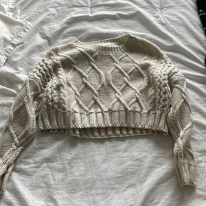 Cropped cable knit sweater
